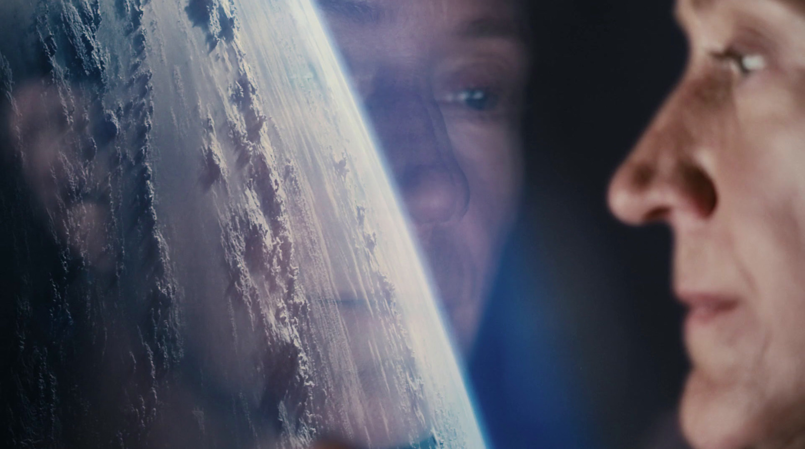 a close up of a person looking at the earth