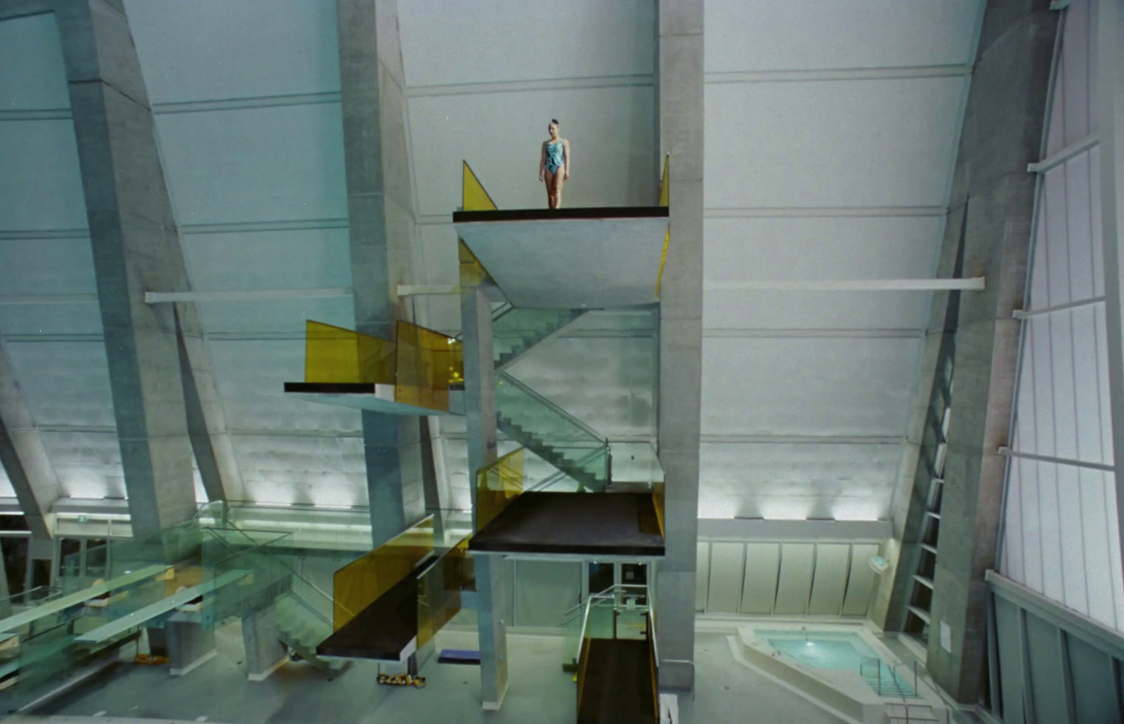 a person standing on top of a staircase in a building