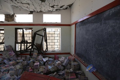 a room filled with lots of boxes and a blackboard