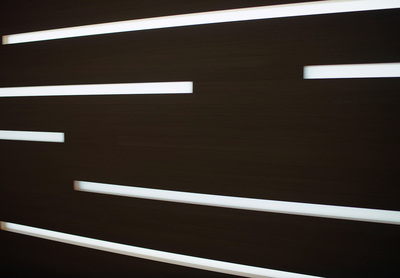 a close up of a black wall with white lines