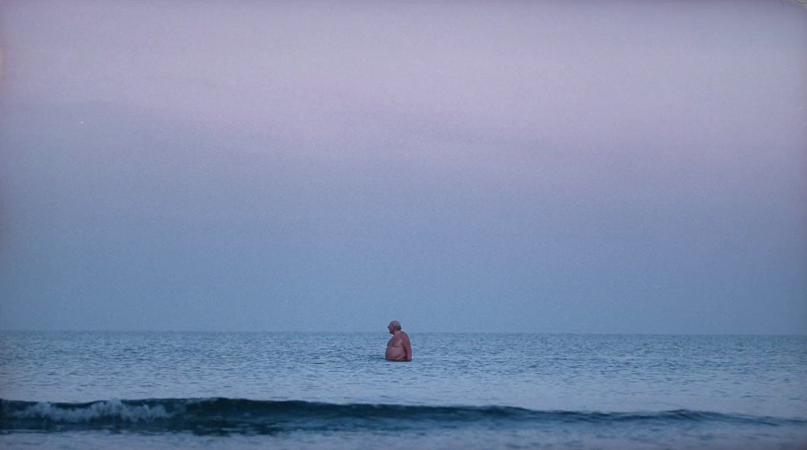 a person standing in the middle of a body of water