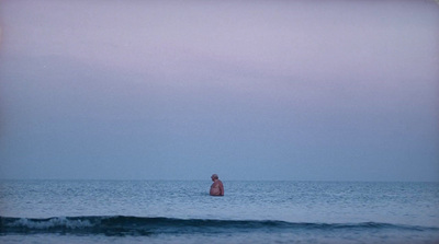 a person standing in the middle of a body of water