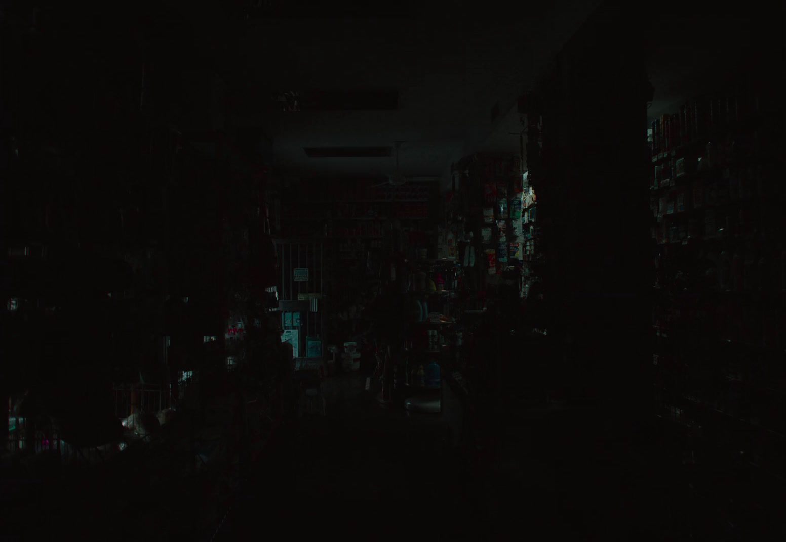 a dark room filled with lots of books