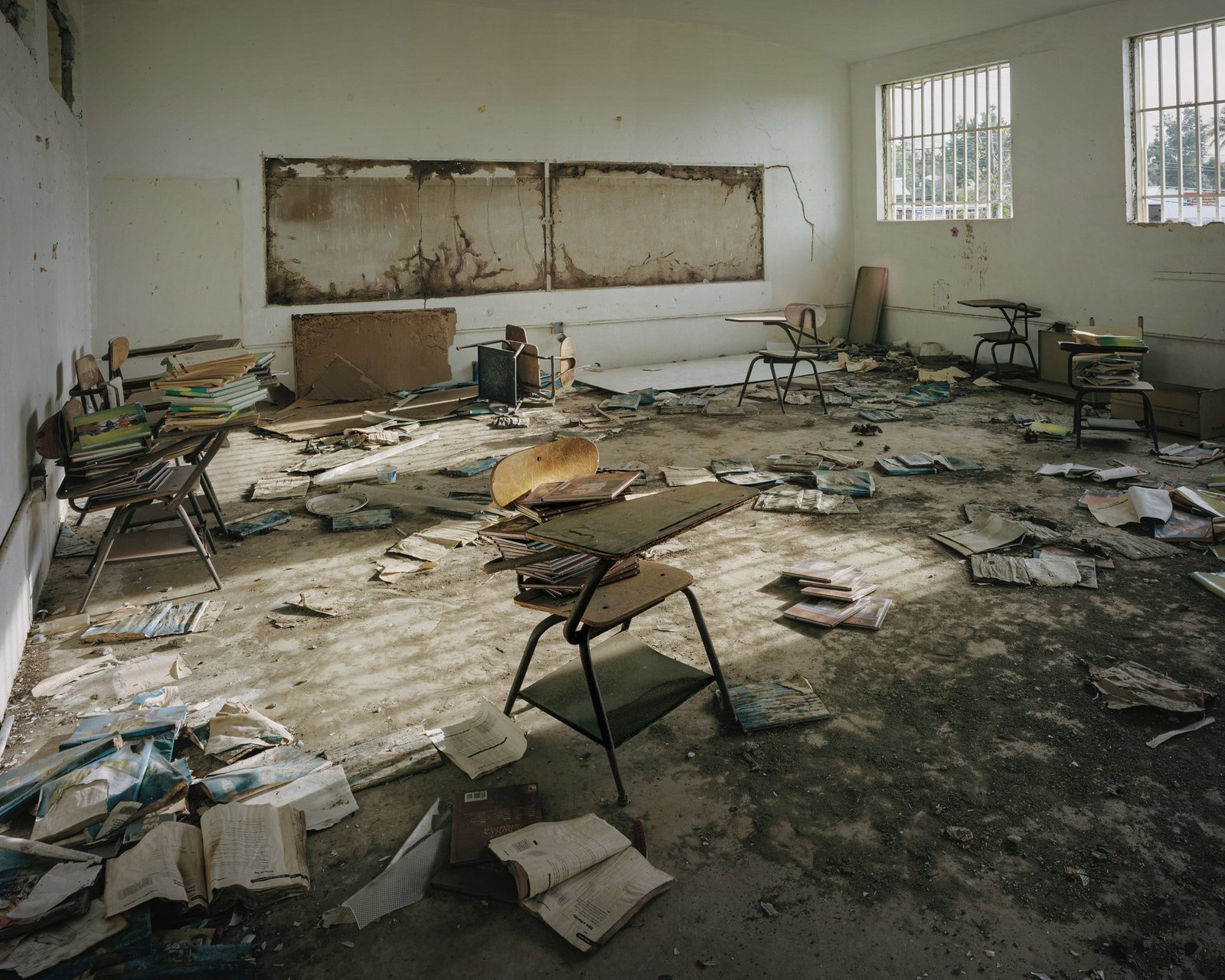 a room filled with lots of books and papers