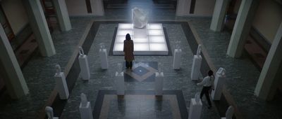 a person standing in a room with a large white object