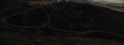 a hill with a clock tower on top of it