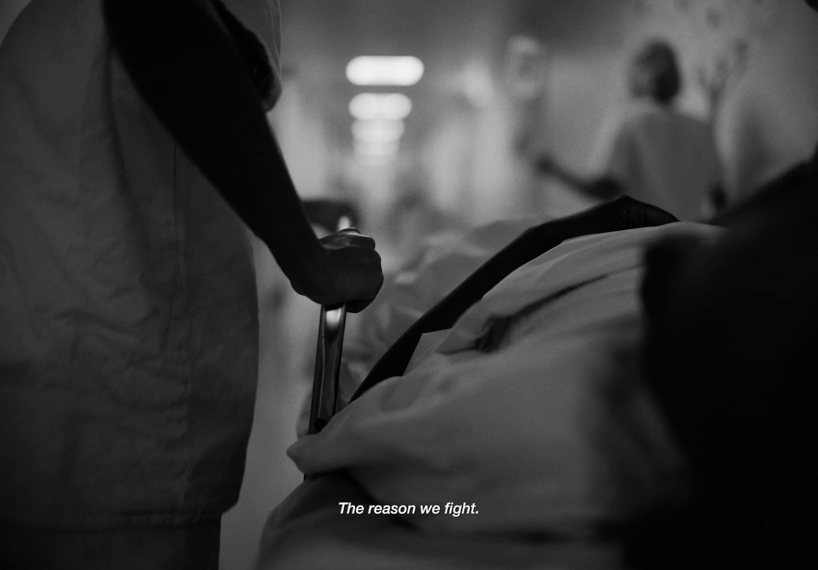 a black and white photo of a person in a hospital bed