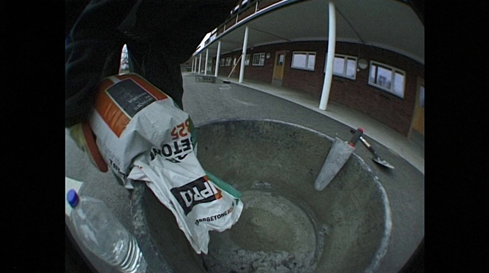 a skateboarder is doing a trick in a bowl