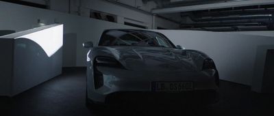 a silver sports car parked in a garage