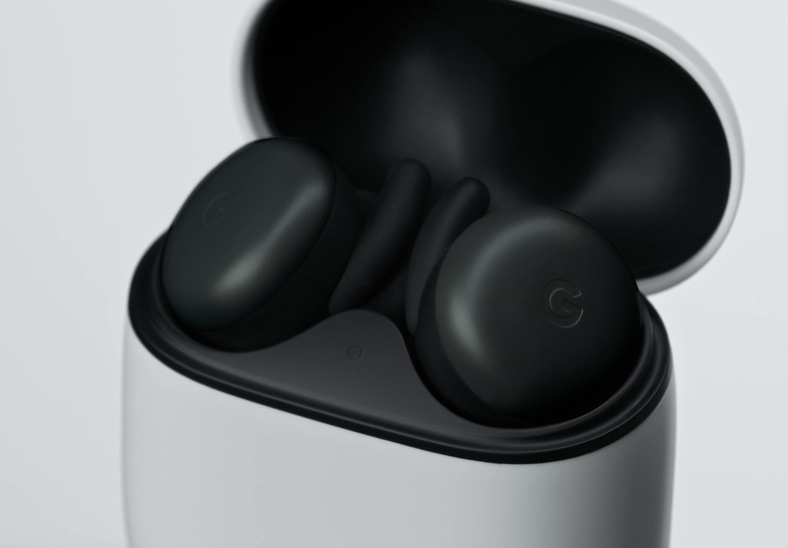 a close up of a pair of black earbuds