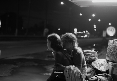 a couple of women sitting next to each other