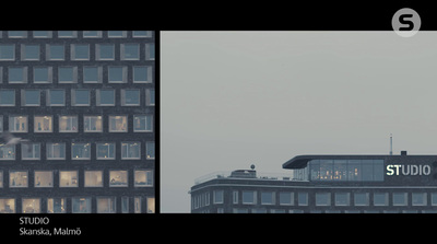 a picture of a building with windows and a plane in the sky