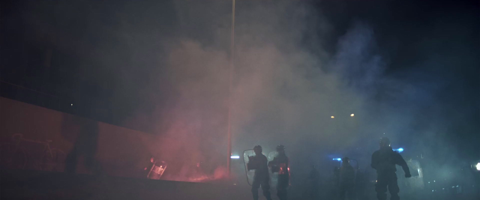 a group of people standing around a fire hydrant