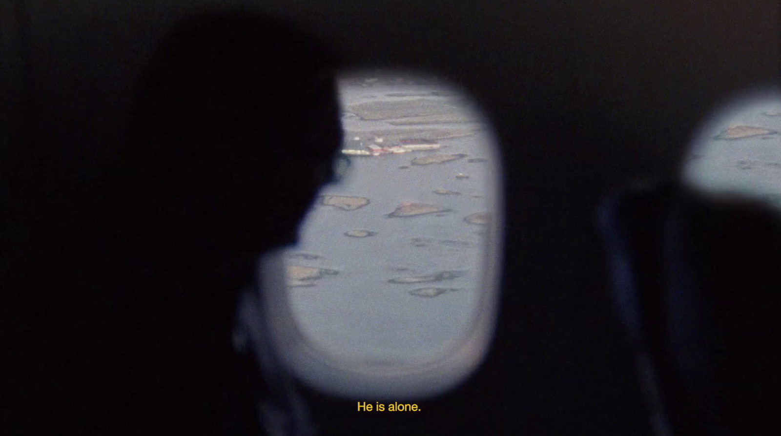 a person looking out of an airplane window