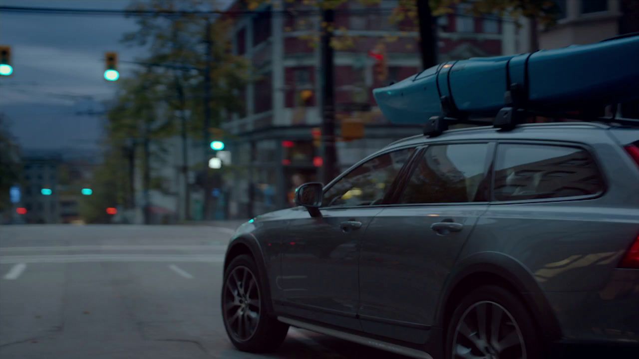 a car with a surfboard on top of it