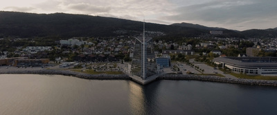 an aerial view of a city near a body of water