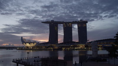 a large body of water next to tall buildings