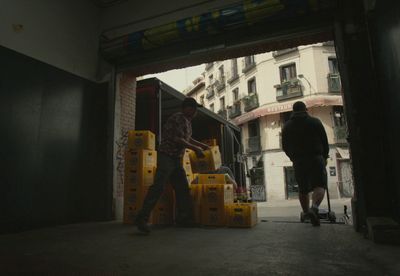 a couple of men walking into a building