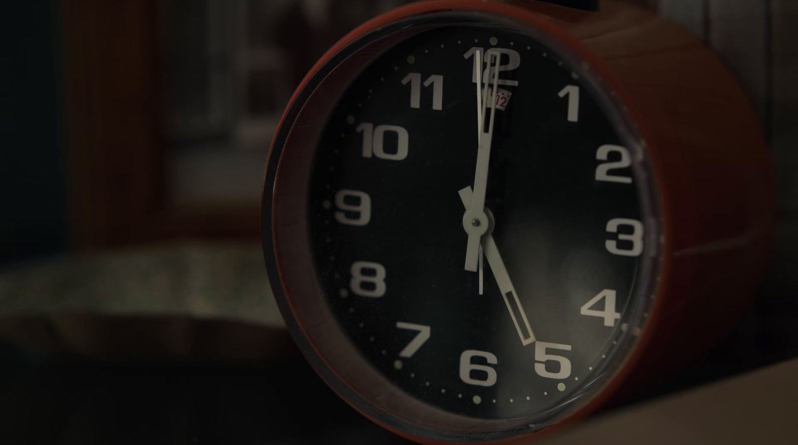 a close up of a clock on a table