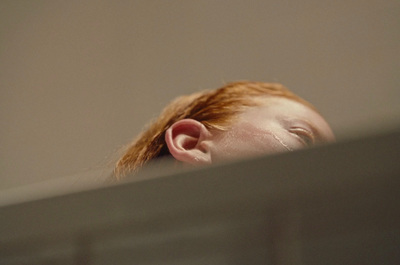 a close up of a person with red hair