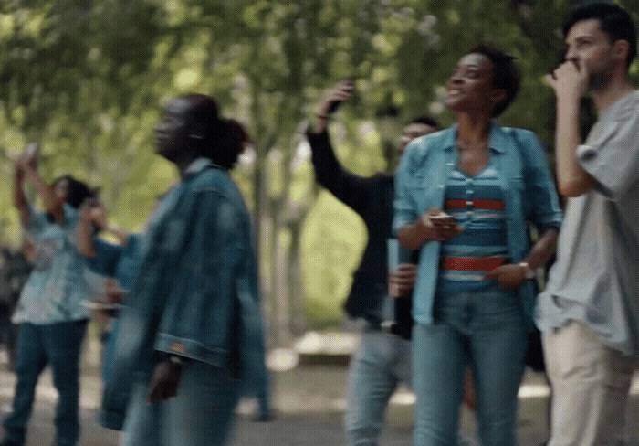 a group of people walking down a street