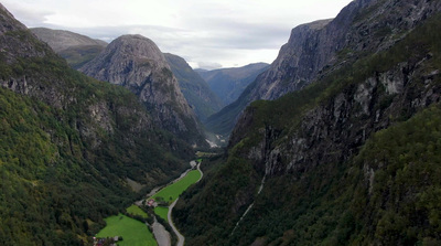 an aerial view of a valley with a river running through it