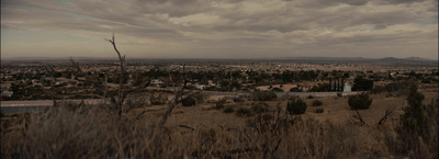 a view of a city from a hill