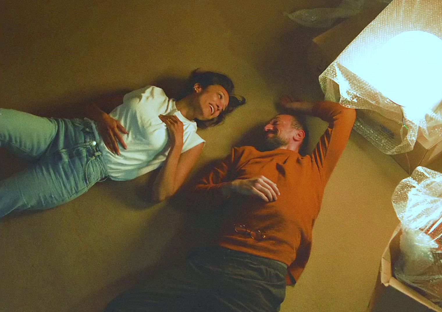 a man and a woman laying on the floor