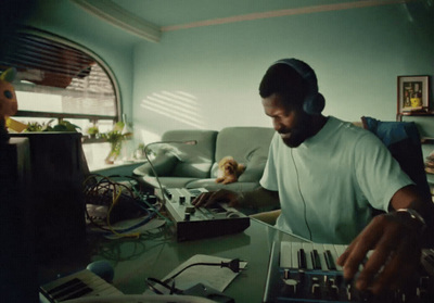 a man sitting at a table with headphones on