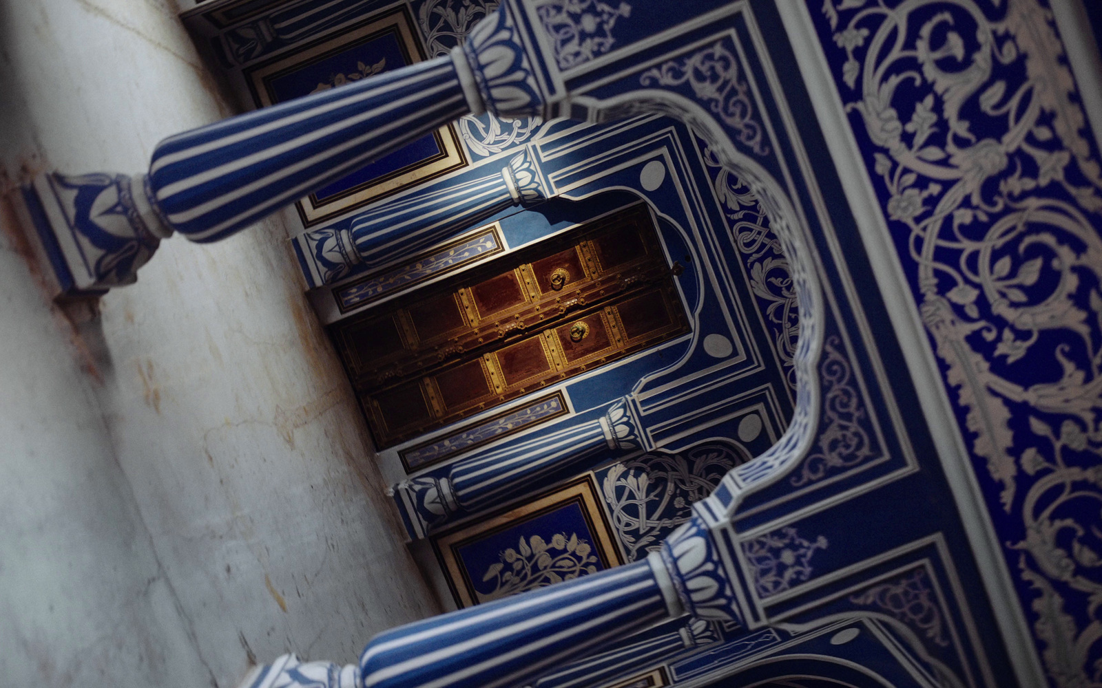 a close up of a blue and white wall