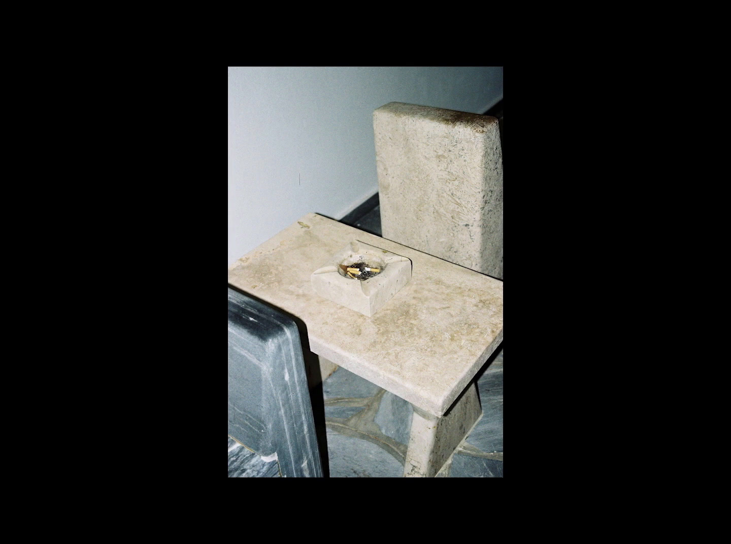 a small table with a ring on top of it