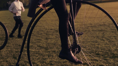 a person riding a bike in a field