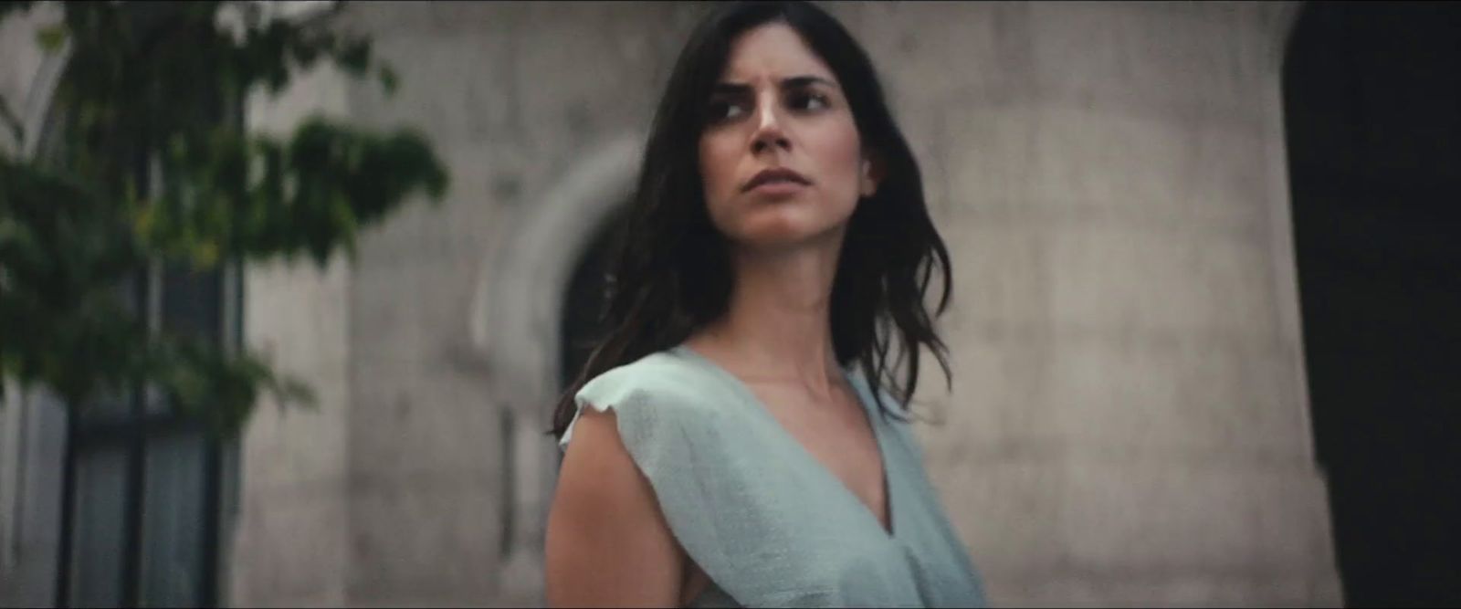 a woman standing in front of a building