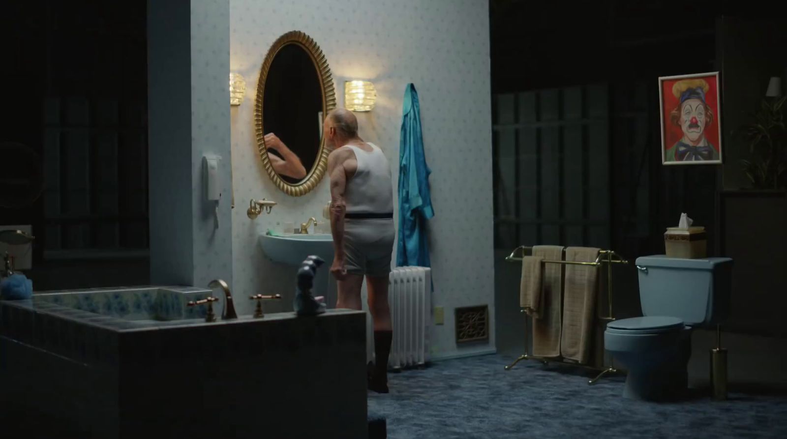 a woman standing in front of a mirror in a bathroom