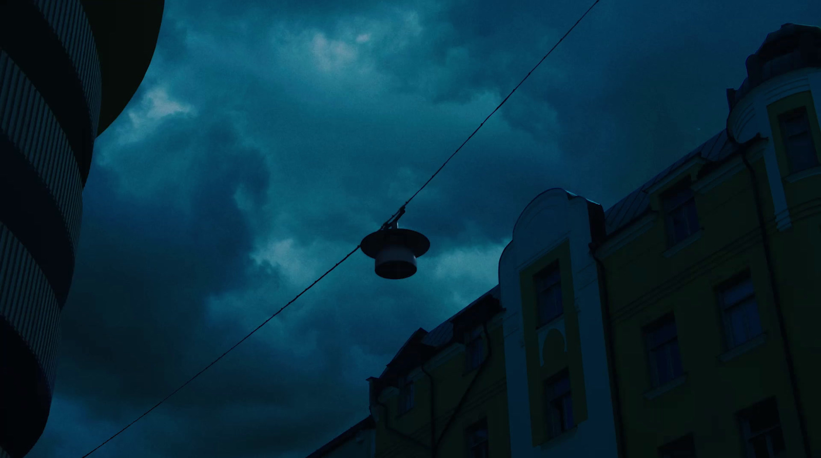 a street light hanging off the side of a building