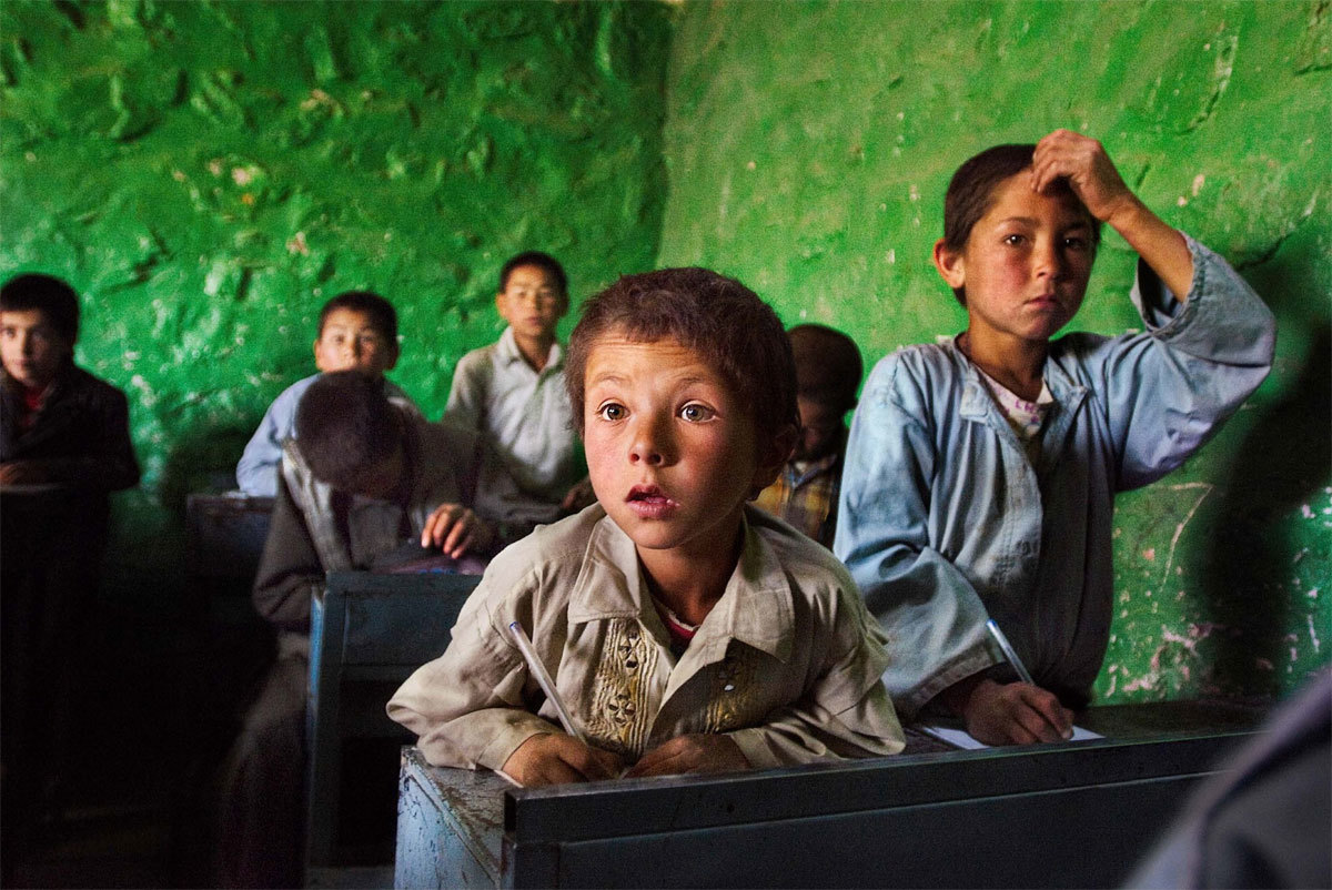 a group of children sitting in a classroom