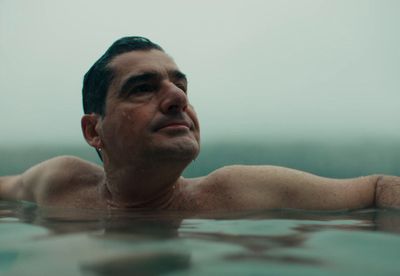 a man swimming in a body of water