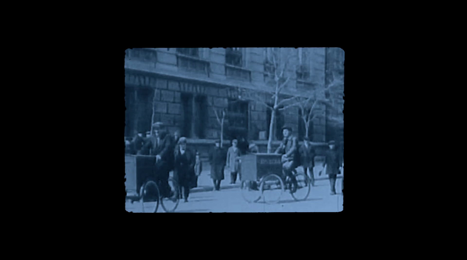 a group of people riding on the back of a horse drawn carriage