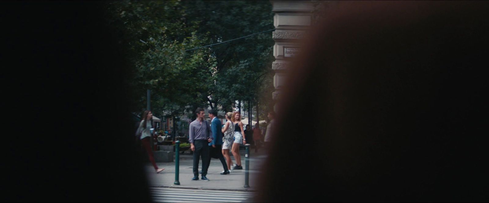 a group of people walking down a street