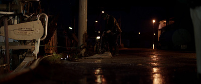 a wet street at night with street lights