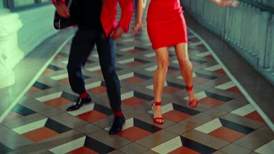 a woman in a red dress and a man in a suit