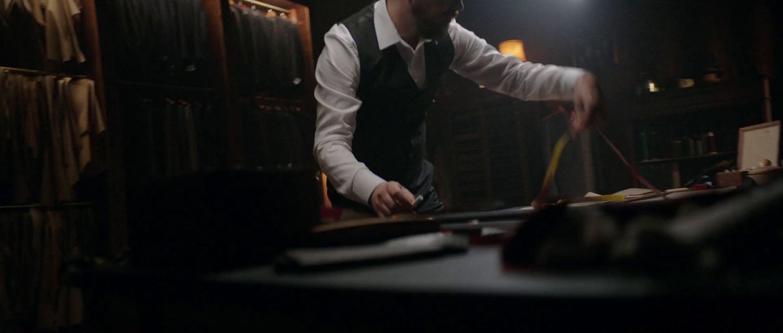 a man standing in a room with a pool table