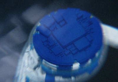 a close up of a blue bottle cap