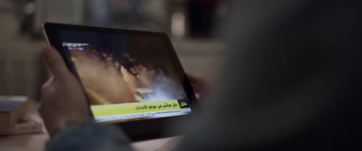 a person holding a tablet with a picture on the screen