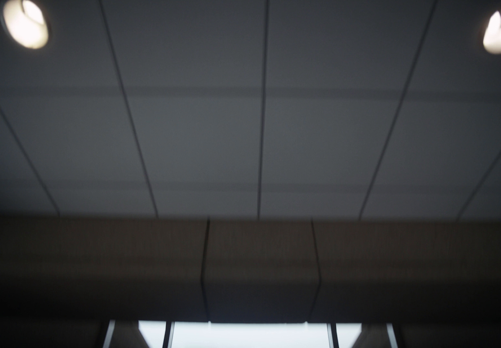 a view of the ceiling of a building through a window