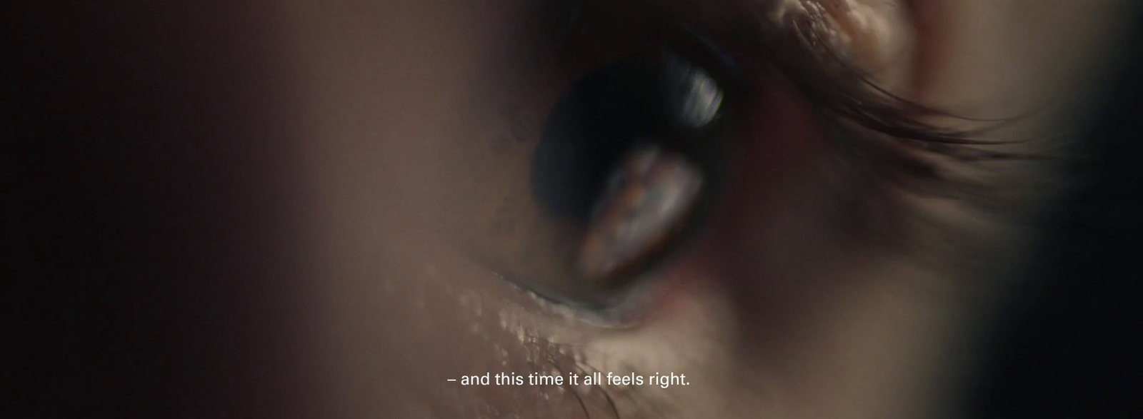 a close up of a person's eye with a blurry background