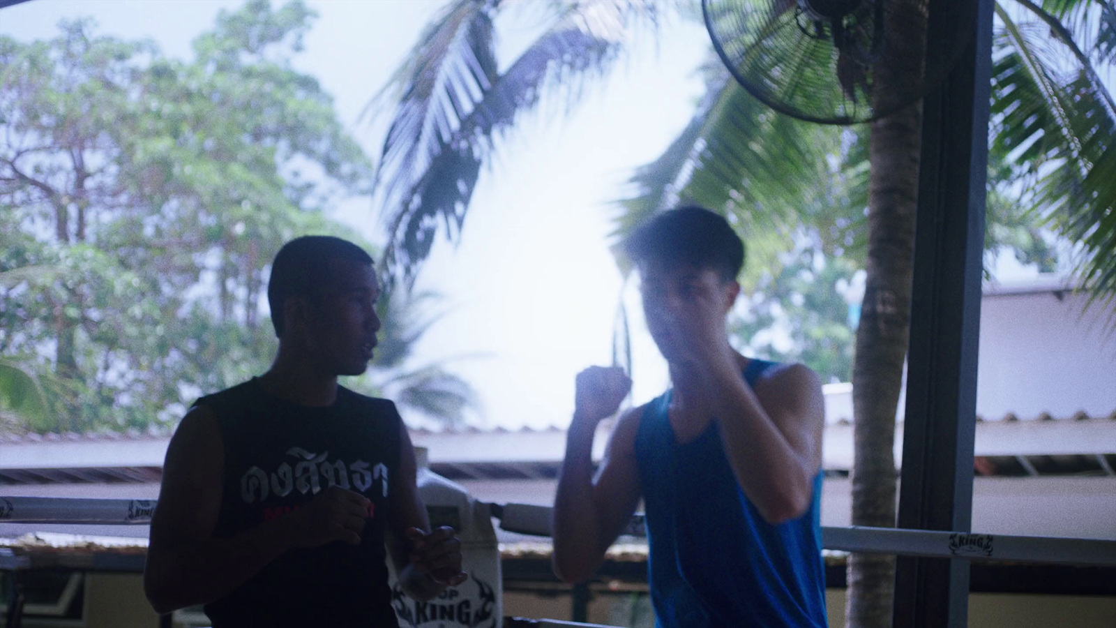 two young men standing next to each other