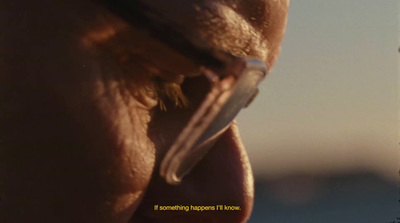 a close up of a person's face with a blurry background