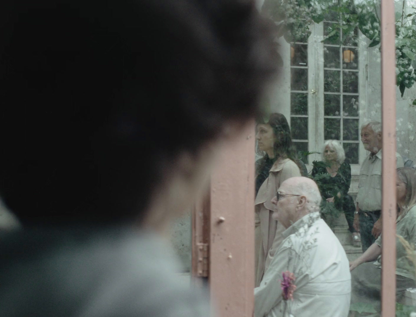 a group of people standing in front of a mirror