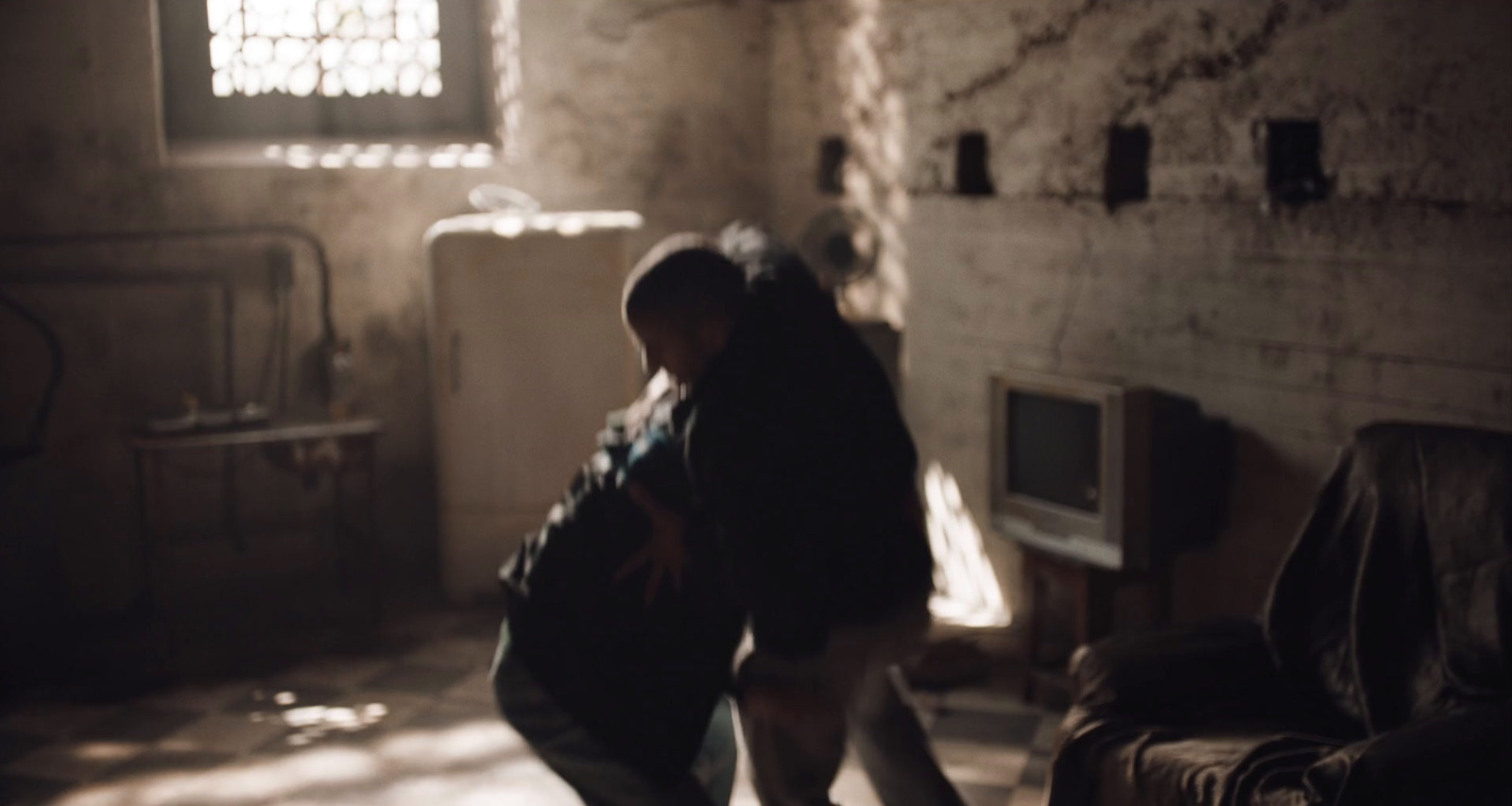 a person standing in a room with a suitcase